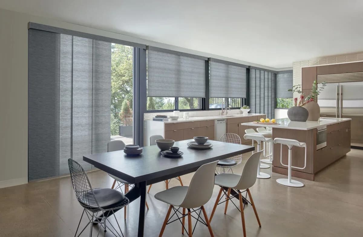 Modern kitchen with gray panel track blinds